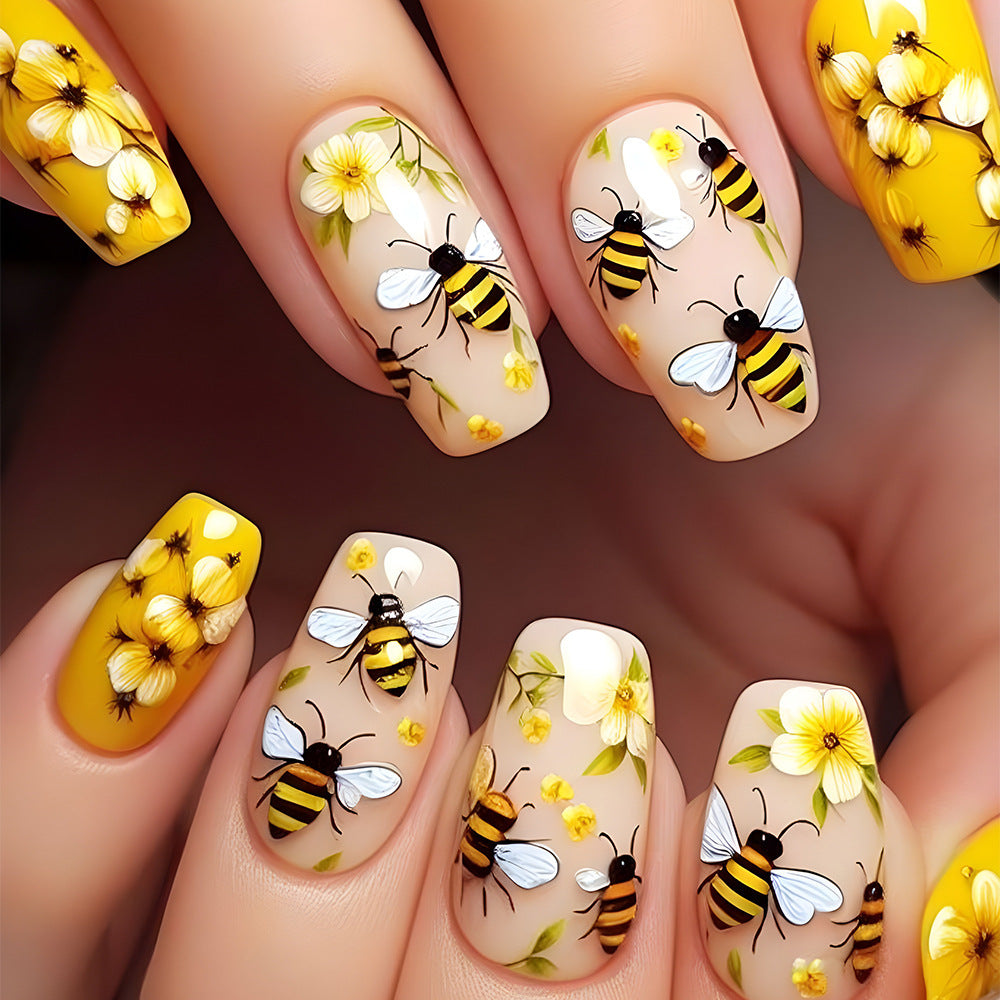 Kunstfingernägel mit Bienen- und Blumenmotiv Brehn