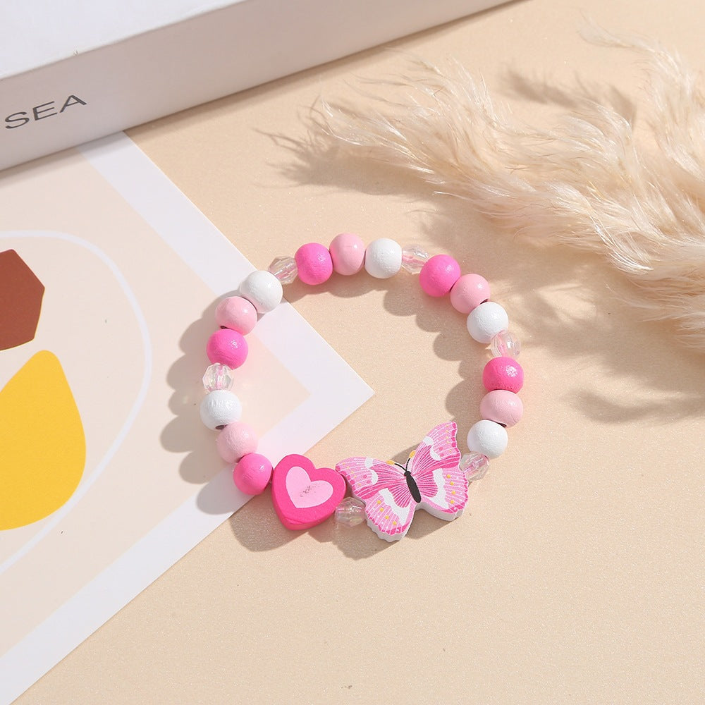 Verspieltes Armband mit Herz- und Schmetterlings-Anhängern Brehn