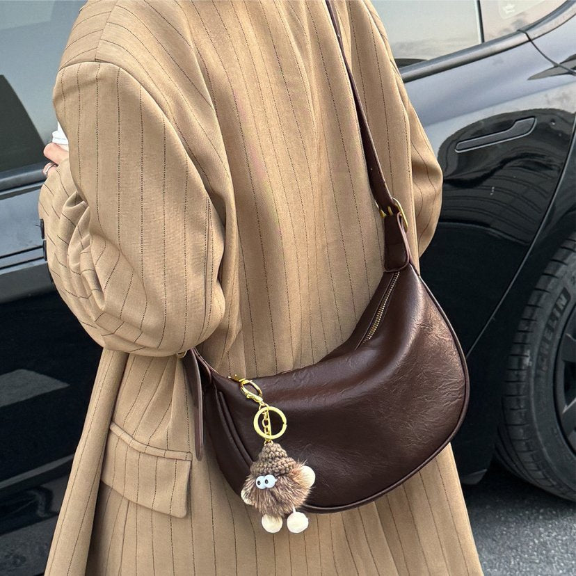 Elegante Kurven-Umhängetasche Brehn
