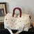 Stylische bestickte Reisetasche