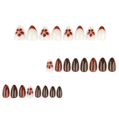 Kunstvolle Nagelverlängerungen mit eleganten floralem und glanzvollem Design Brehn