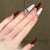 Glamouröse Kunstnageldesigns mit Kristallverzierung Brehn
