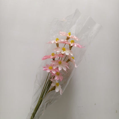 Vibrant künstlicher Blumenstrauß mit stilvoller Verpackung