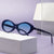 Damen stilvolle Sonnenbrille im ovalen Design Brehn