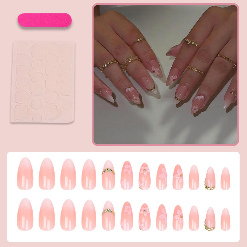 Kunstnagelset mit romantischen Blüten- und Glitzerakzenten Brehn