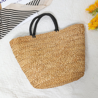 Elegante Basttasche mit Kontrastgriffen Brehn