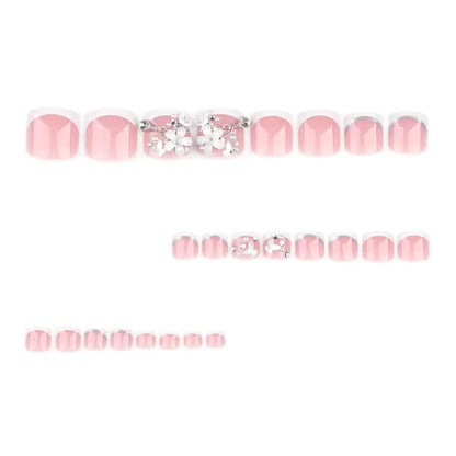 Kunstnagelset mit eleganten Blumenverzierungen und Hochglanz-Finish Brehn