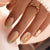 Kunstnagelset mit eleganten Goldakzenten Brehn
