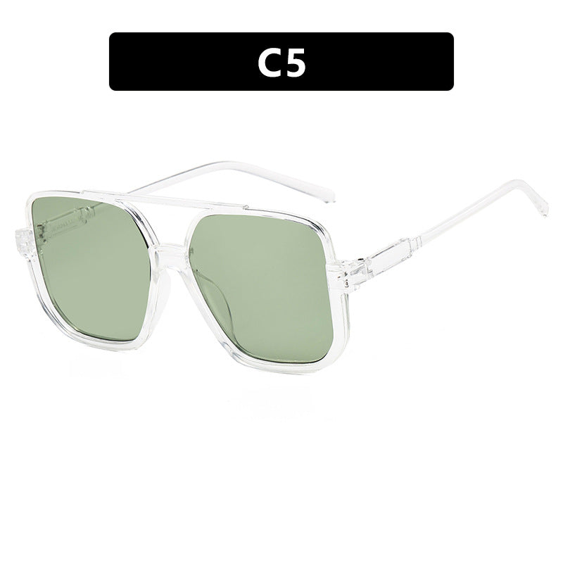 Damen quadratische Sonnenbrille mit transparentem Rahmen und grün getönten Gläsern Brehn
