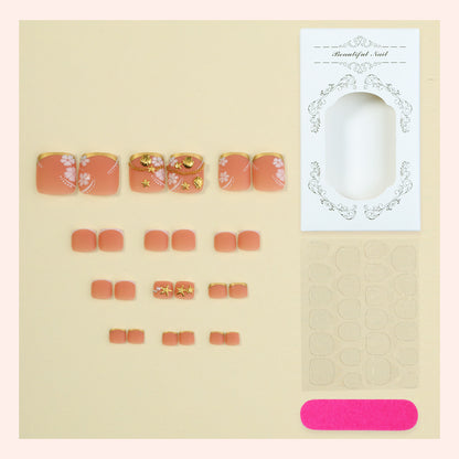 Floral Design Press-On Nagelset mit goldenen Akzenten Brehn