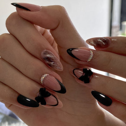 Künstlerische Stiletto-Nagelkunstverlängerungen mit Schleifenakzenten Brehn