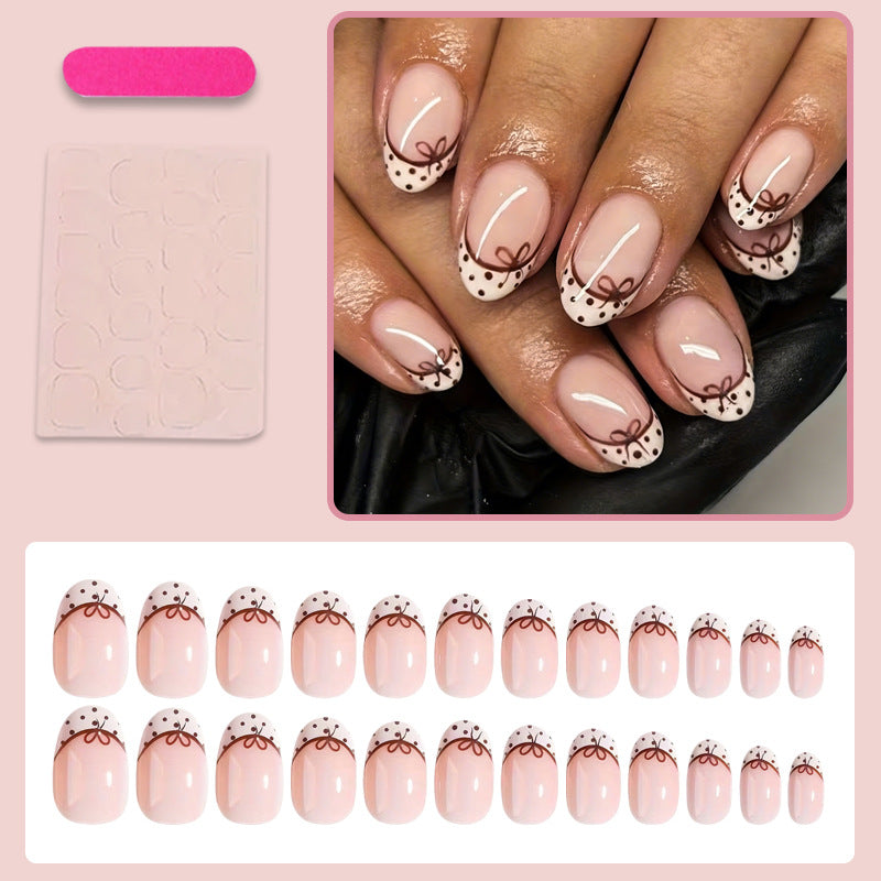 Kunstnagelset mit eleganten Schleifen- und Punktmotiven Brehn
