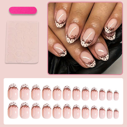 Kunstnagelset mit eleganten Schleifen- und Punktmotiven Brehn