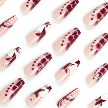 Kunstvolle Nagelverlängerungen mit Glitzer und Sternenmotiven Brehn