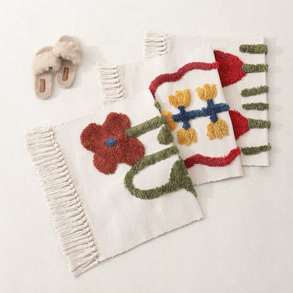 Handgewebter Baumwoll-Badmattenteppich mit Tufting-Blumenapplikation und Quasten Brehn