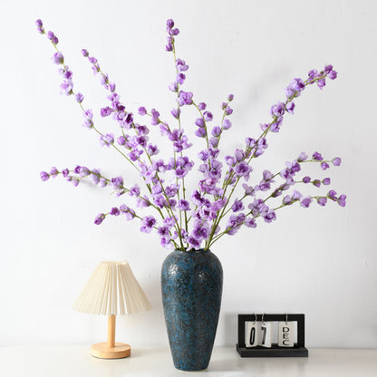 Dekorative florale Erbsenblütenstielanordnung