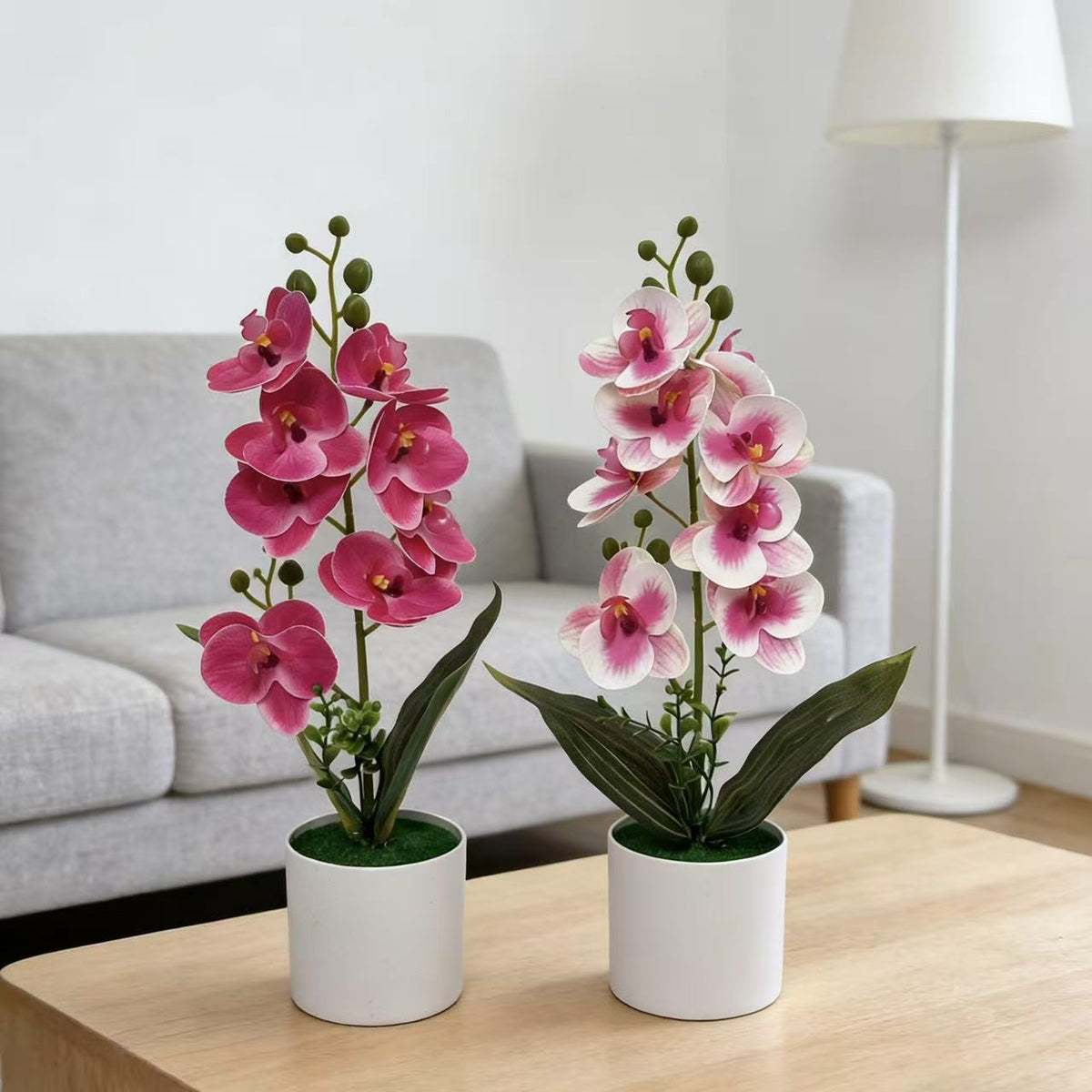 Dekorative künstliche Orchideenarrangement für Tischdeko