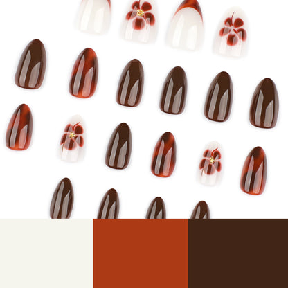 Kunstvolle Nagelverlängerungen mit eleganten floralem und glanzvollem Design Brehn