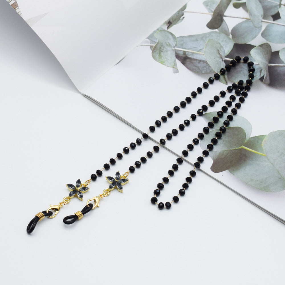Eleganter mit Blumenakzenten verzierter Brillenketten Brehn