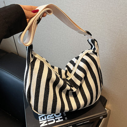 Lässige gestreifte Schultertasche