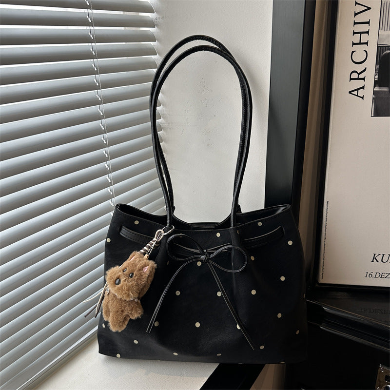 Elegante gepunktete Tragetasche