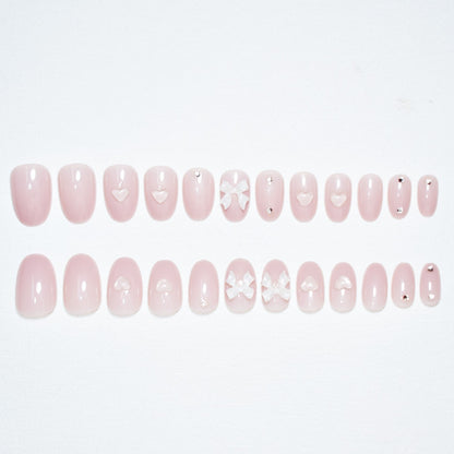 Künstlerisches Press-On Nagelset mit eleganten Schleifenakzenten Brehn