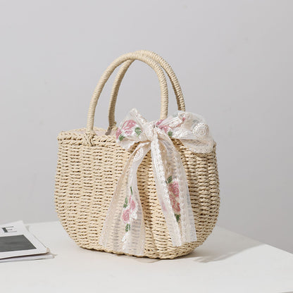 Elegante Basttasche mit Floralem Schleifendetail Brehn
