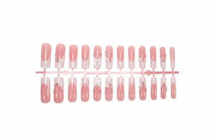 Kunstnagelset mit eleganten Schleifen und Glitzerakzenten Brehn