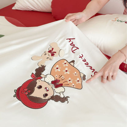 Bettwäsche-Set mit bestickten Puppen- und Apfelmotiven