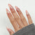 Elegante Stiletto Press-On Nagel Set mit Marmor Design Brehn