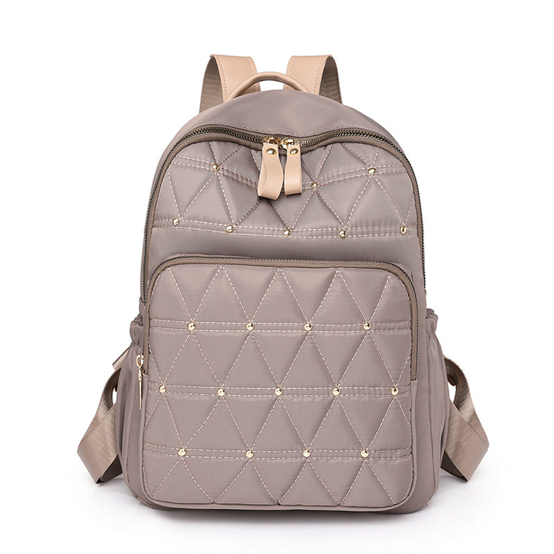 Stylische gesteppten Rucksack mit goldenen Akzenten