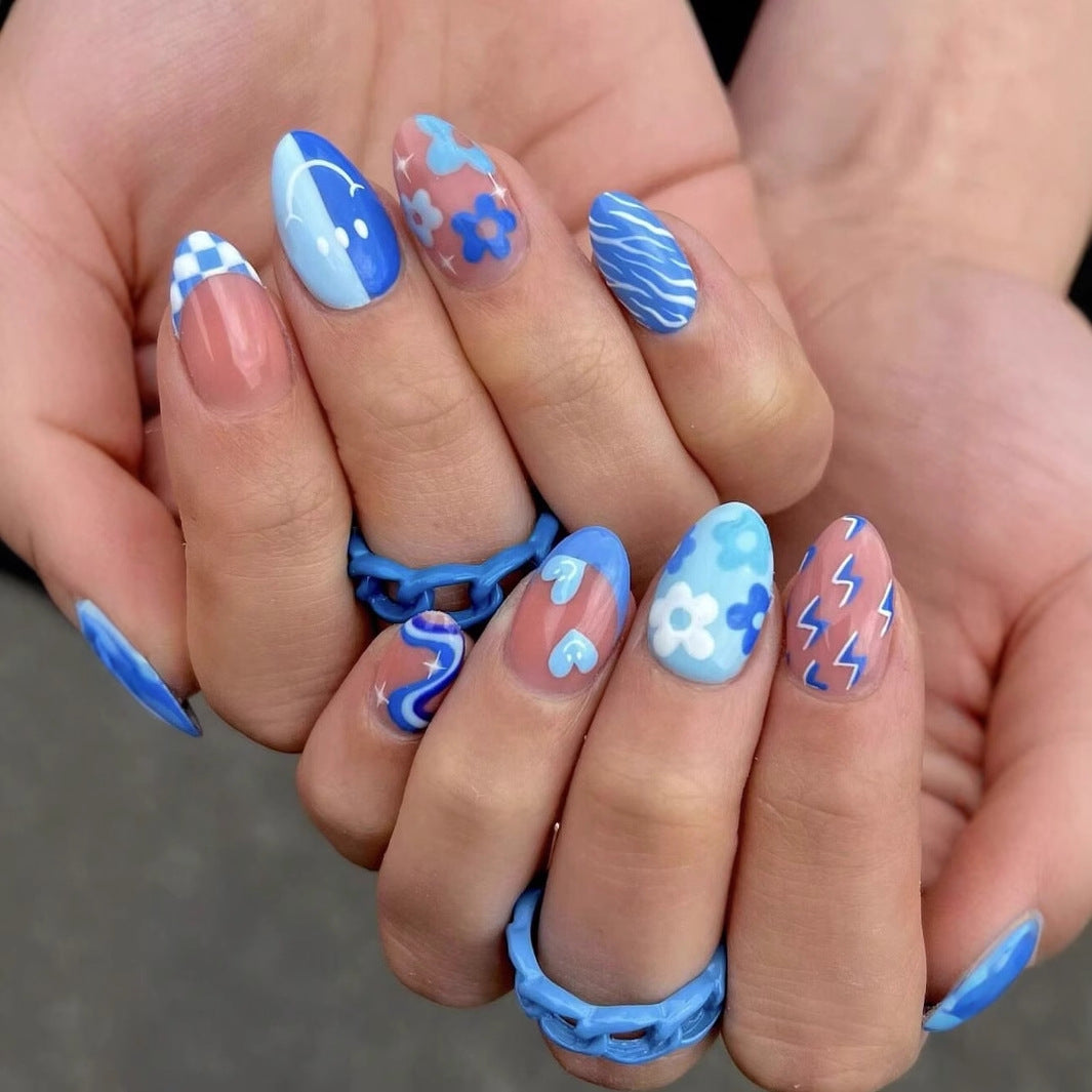 Kunstnagelset mit buntem Blumenmuster und kreativen Akzenten Brehn