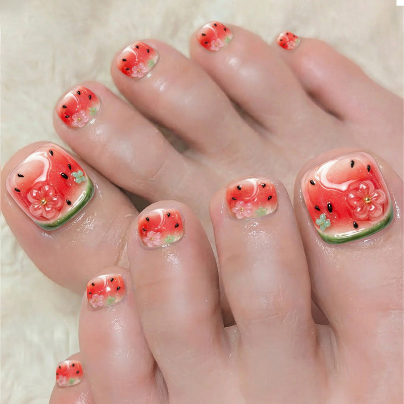 Kreatives Kunstnagelset mit fröhlichen Wassermelonenmotiven und zarten Blütenakzenten Brehn