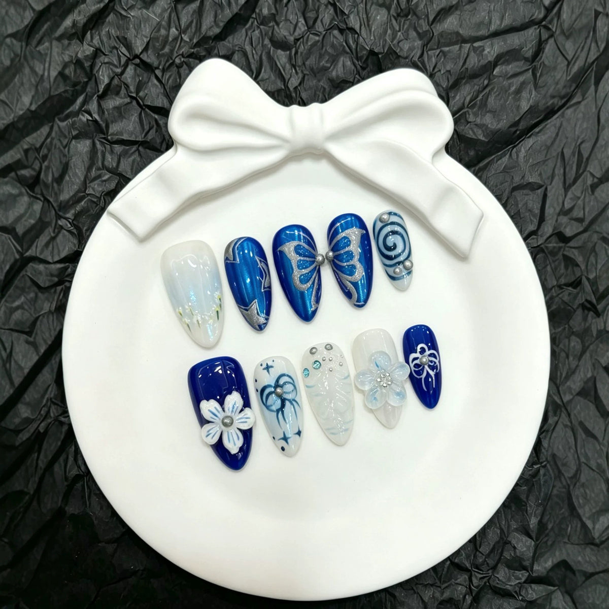 Dekorative Schmetterlings Press-On Nagelkunst Kollektion