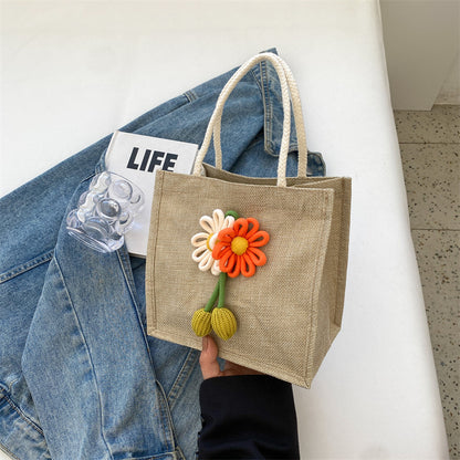Blumenverzierte Tasche