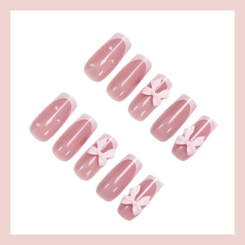 Kunstnagelset mit verspielten Schleifendesigns und eleganten Akzenten Brehn