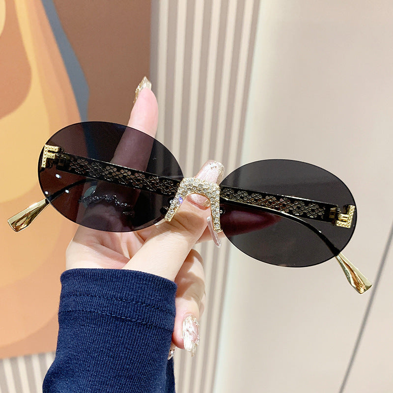 Damen Sonnenbrille mit glitzerndem Rahmen und ovalen Gläsern Brehn