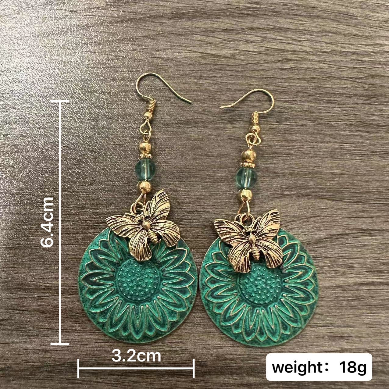 Elegante Ohrhänger mit Blumenmotiv und Schmetterlingen Brehn