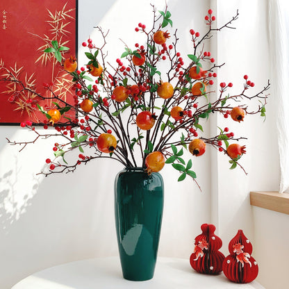 Dekorative Granatapfelblütenarrangement
