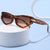 Damen trendige Cat-Eye-Sonnenbrille mit lackiertem Rahmen und akzentuierten Metall-Details Brehn