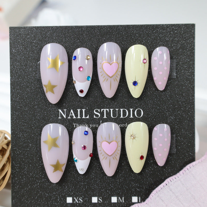 Kunstnagelset mit stilvollen Herz- und Sternmotiven Brehn