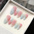 Kunstnagelset mit elegantem Ombre-Design und Blütenverzierungen Brehn