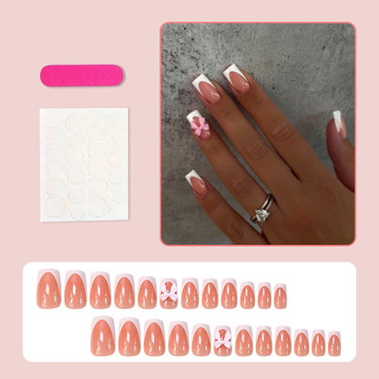 Kunstnagelset mit eleganten Spitzen und verspielten Schleifen Brehn