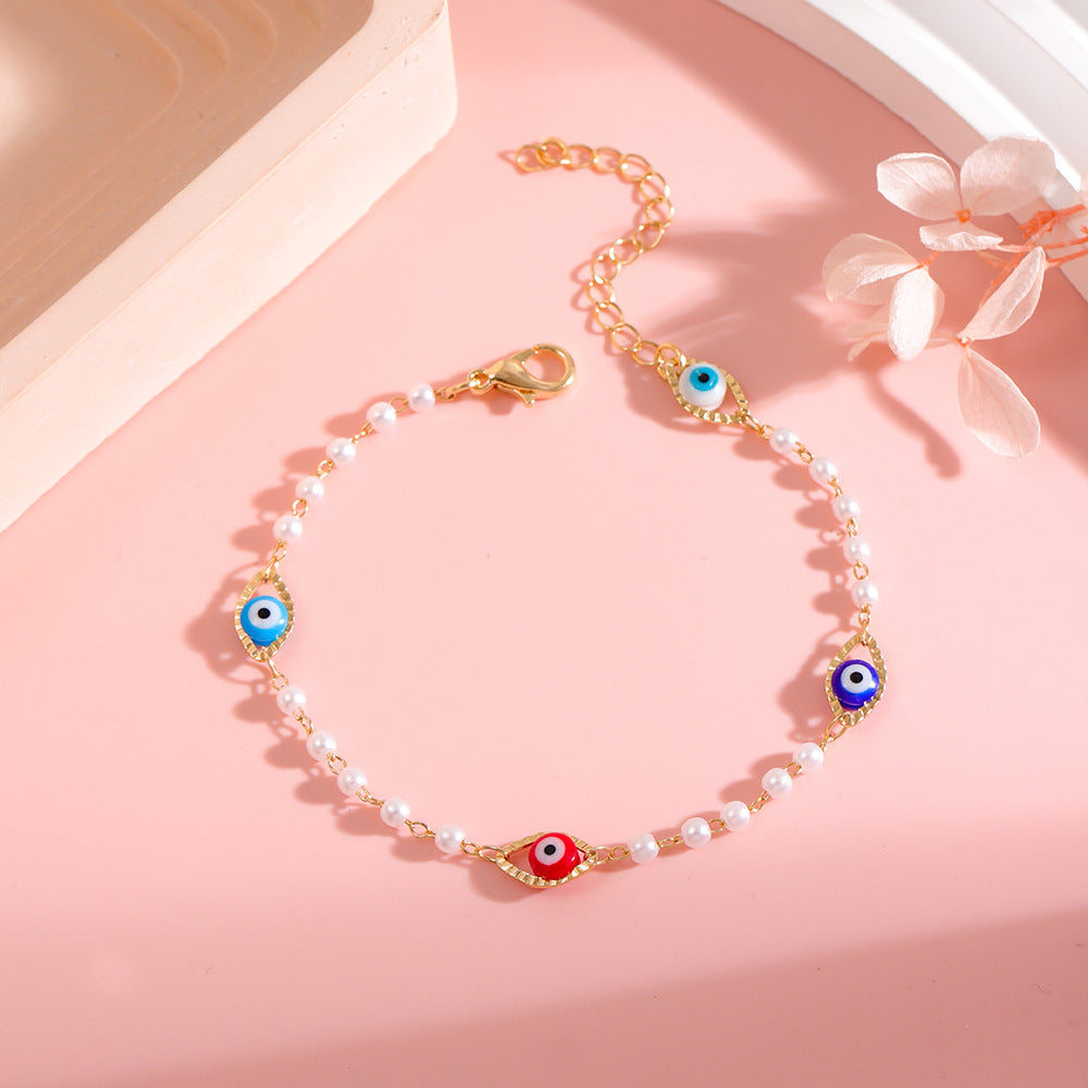 Elegante Perlen- und Augen-Anhänger-Halskette Brehn