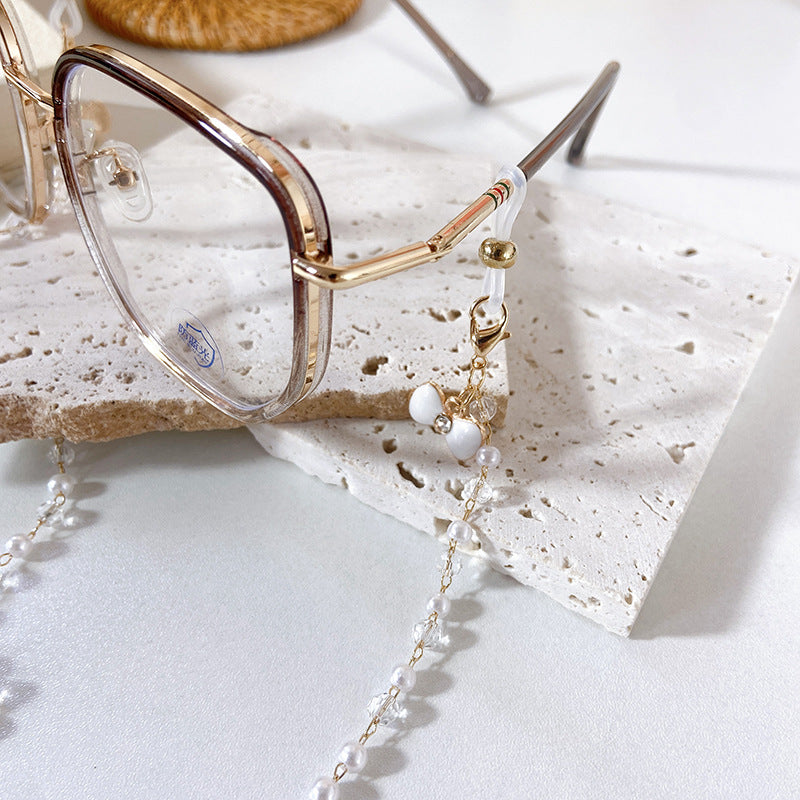 Elegante Ohrringe mit Perlen und Blütenanhängern Brehn