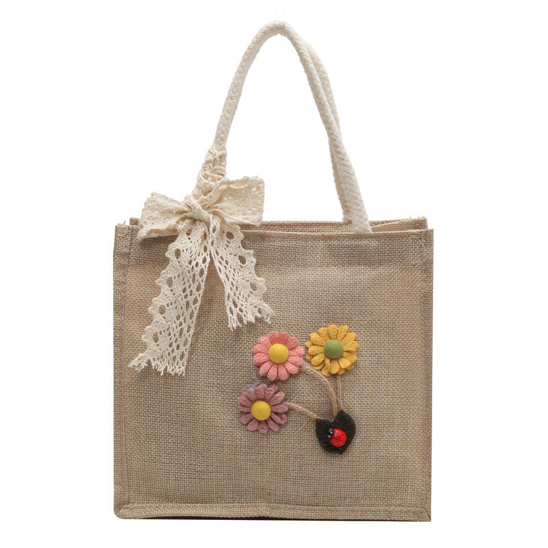 Blumennietete Jute-Handtasche