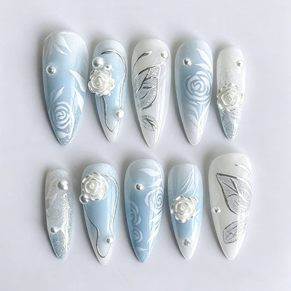 Kunstnagelset mit elegant floralen Motiven und Glitzereffekten Brehn