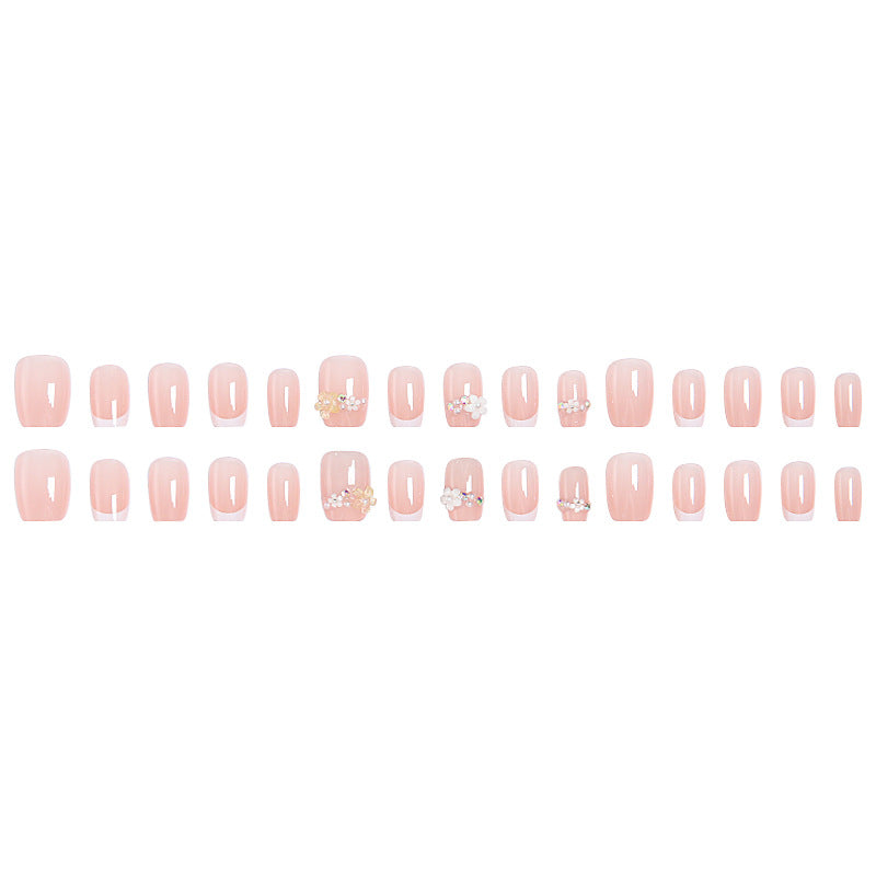 Kunstnagelset mit eleganten Blumenapplikationen und exquisite Glitzerverzierungen Brehn