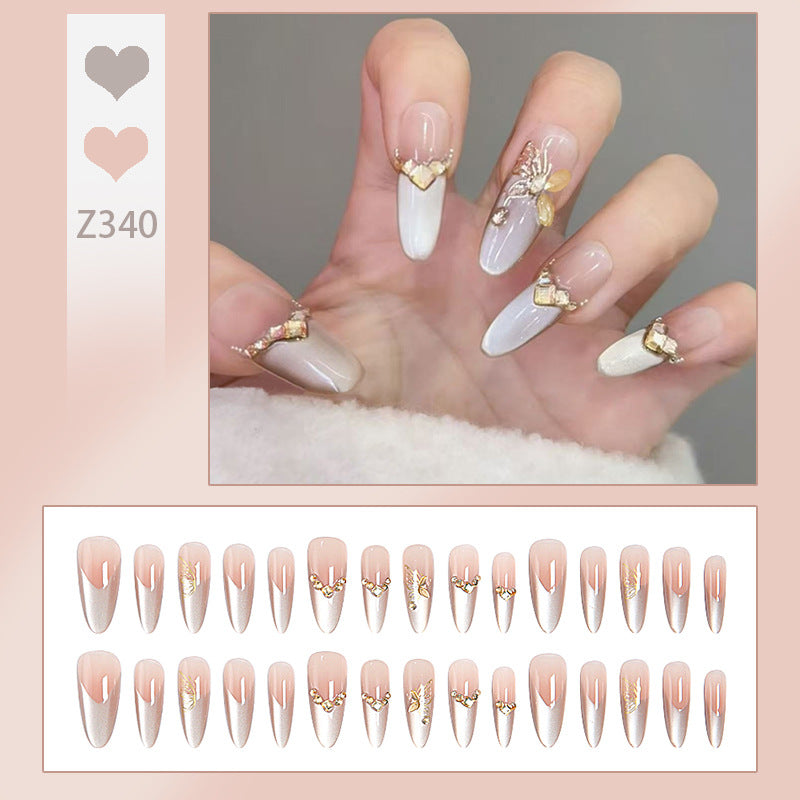 Glamouröse Kunstnägel mit eleganten Golden Details Brehn