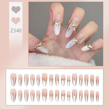 Glamouröse Kunstnägel mit eleganten Golden Details Brehn